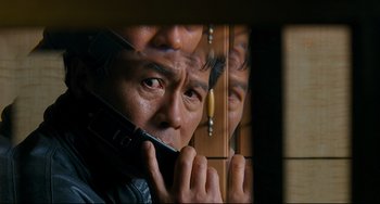 Movie still from “I Saw the Devil” (2010), directed by Jee-woon Kim – A man is looking at himself in the mirror; Close Up shot, Low angle