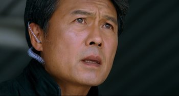 Movie still from “I Saw the Devil” (2010), directed by Jee-woon Kim – A man's face looking upward; Close Up shot, Low angle