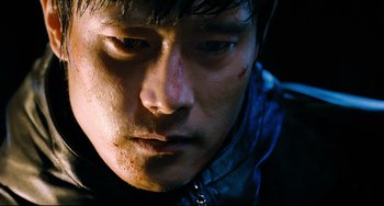 Movie still from “I Saw the Devil” (2010), directed by Jee-woon Kim – A man's face with blood all over his face; Close Up shot, Low angle