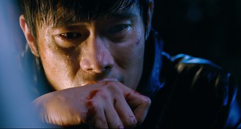Movie still from “I Saw the Devil” (2010), directed by Jee-woon Kim – A person with blood on his face; Close Up shot, Overhead angle