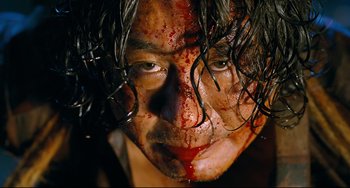 A person's face covered in blood
