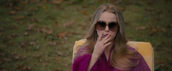 Movie still from “I'm Your Woman” (2020), directed by Julia Hart – A woman in sunglasses is smoking a cigarette; Medium shot, Over the shoulder angle