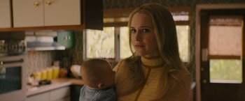 Movie still from “I'm Your Woman” (2020), directed by Julia Hart – A woman holding a baby in her arms; Close Up shot, Over the shoulder angle