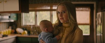 Movie still from “I'm Your Woman” (2020), directed by Julia Hart – A woman holding a baby in her arms; Close Up shot, Over the shoulder angle