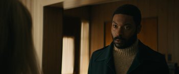 Movie still from “I'm Your Woman” (2020), directed by Julia Hart – A person wearing a jacket; Close Up shot, Over the shoulder angle