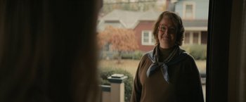 Movie still from “I'm Your Woman” (2020), directed by Julia Hart – A woman standing in front of a house; Medium shot, Over the shoulder angle