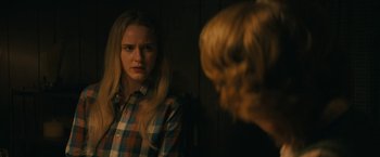 Movie still from “I'm Your Woman” (2020), directed by Julia Hart – A woman looking in the mirror while standing next to another woman; Close Up shot, Over the shoulder angle