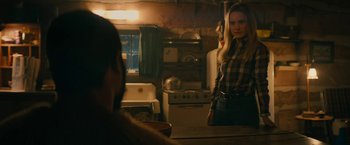 Movie still from “I'm Your Woman” (2020), directed by Julia Hart – A woman standing in front of an oven in a kitchen; Medium shot, Over the shoulder angle