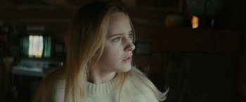 Movie still from “I'm Your Woman” (2020), directed by Julia Hart – A woman with long blonde hair wearing a white sweater; Close Up shot, Low angle