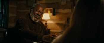 Movie still from “I'm Your Woman” (2020), directed by Julia Hart – An older man sitting at a table with a glass of wine; Close Up shot, Over the shoulder angle