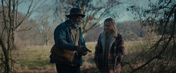 Movie still from “I'm Your Woman” (2020), directed by Julia Hart – An older man and a young woman standing next to each other; Medium shot, Over the shoulder angle