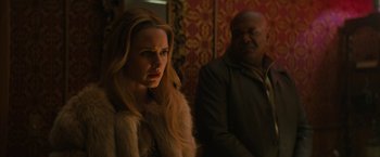 Movie still from “I'm Your Woman” (2020), directed by Julia Hart – A woman and a man standing next to each other in a room; Close Up shot, Over the shoulder angle