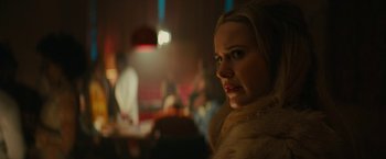 Movie still from “I'm Your Woman” (2020), directed by Julia Hart – A person wearing a fur coat; Close Up shot, Over the shoulder angle