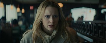 Movie still from “I'm Your Woman” (2020), directed by Julia Hart – A person with long hair wearing a sweater; Close Up shot, Over the shoulder angle
