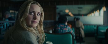 Movie still from “I'm Your Woman” (2020), directed by Julia Hart – A woman sitting at a table in a restaurant; Close Up shot, Over the shoulder angle