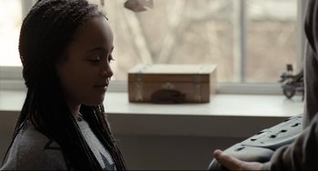 Movie still from “I, Daniel Blake” (2016), directed by Ken Loach – A young girl sitting in front of a window; Close Up shot, Over the shoulder angle