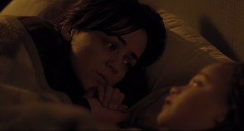 Movie still from “I, Daniel Blake” (2016), directed by Ken Loach – A woman laying in a bed with her head resting on a pillow; Close Up shot, High angle