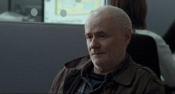 Movie still from “I, Daniel Blake” (2016), directed by Ken Loach – An older man sitting in front of a computer screen; Close Up shot, Over the shoulder angle