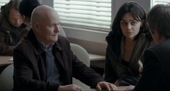 Movie still from “I, Daniel Blake” (2016), directed by Ken Loach – A man and a woman sitting at a table; Medium shot, Over the shoulder angle