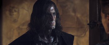 Movie still from “I, Frankenstein” (2014), directed by Stuart Beattie – A person with long black hair; Close Up shot, Low angle