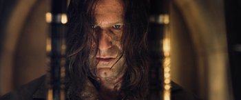 Movie still from “I, Frankenstein” (2014), directed by Stuart Beattie – A person with long black hair; Close Up shot, Low angle