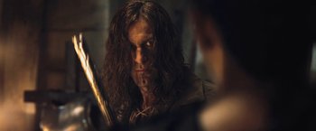 Movie still from “I, Frankenstein” (2014), directed by Stuart Beattie – A person with long curly hair; Close Up shot, Over the shoulder angle