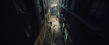 Movie still from “I, Frankenstein” (2014), directed by Stuart Beattie – A person walking down an alley way at night; Extreme Wide shot, High angle