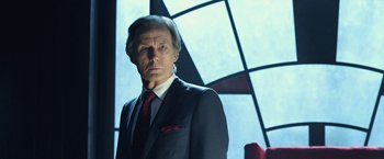 Movie still from “I, Frankenstein” (2014), directed by Stuart Beattie – A man in a suit and tie standing in front of a window; Close Up shot, Low angle