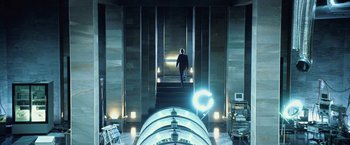 Movie still from “I, Frankenstein” (2014), directed by Stuart Beattie – A man walking up a set of stairs in a building; Wide shot, Low angle