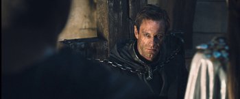 Movie still from “I, Frankenstein” (2014), directed by Stuart Beattie – A person wearing chains on their neck; Close Up shot, Over the shoulder angle