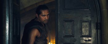 Movie still from “I, Frankenstein” (2014), directed by Stuart Beattie – A person standing in front of a door; Medium shot, Over the shoulder angle