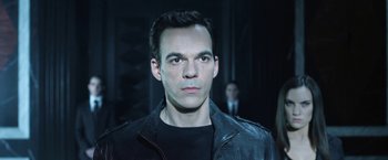 Movie still from “I, Frankenstein” (2014), directed by Stuart Beattie – A man wearing a black leather jacket and looking at the camera; Close Up shot, Over the shoulder angle