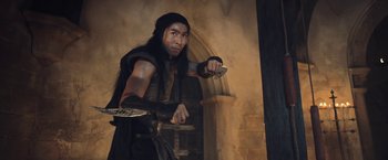 Movie still from “I, Frankenstein” (2014), directed by Stuart Beattie – A man dressed in medieval clothing holding a sword; Medium shot, Low angle