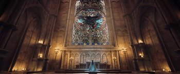 Movie still from “I, Frankenstein” (2014), directed by Stuart Beattie – A woman standing in front of a stained - glass window; Extreme Wide shot, Low angle