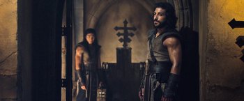 Movie still from “I, Frankenstein” (2014), directed by Stuart Beattie – Two men standing next to each other near a cross; Medium shot, Over the shoulder angle