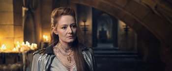 Movie still from “I, Frankenstein” (2014), directed by Stuart Beattie – A woman with long red hair wearing a silver jacket; Close Up shot, Over the shoulder angle