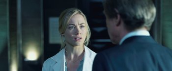 Movie still from “I, Frankenstein” (2014), directed by Stuart Beattie – A woman in a white jacket and a man in a blue suit; Close Up shot, Over the shoulder angle