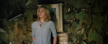 Movie still from “I, Frankenstein” (2014), directed by Stuart Beattie – A woman standing in front of a stone wall; Medium shot, Over the shoulder angle