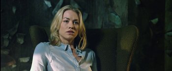 Movie still from “I, Frankenstein” (2014), directed by Stuart Beattie – A woman with blonde hair wearing a button up shirt; Close Up shot, Over the shoulder angle