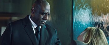 Movie still from “I, Frankenstein” (2014), directed by Stuart Beattie – A man in a black suit and a white tie; Close Up shot, Low angle