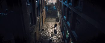 Movie still from “I, Frankenstein” (2014), directed by Stuart Beattie – A person walking down a brick street at night; Extreme Wide shot, High angle