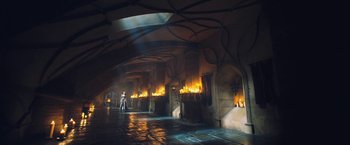 Movie still from “I, Frankenstein” (2014), directed by Stuart Beattie – A person standing in a room with candles; Extreme Wide shot, High angle