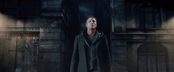 Movie still from “I, Frankenstein” (2014), directed by Stuart Beattie – A man standing in front of a building looking up; Medium shot, Low angle