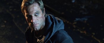 Movie still from “I, Frankenstein” (2014), directed by Stuart Beattie – A person wearing a hooded sweatshirt; Close Up shot, Low angle