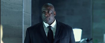 Movie still from “I, Frankenstein” (2014), directed by Stuart Beattie – A man in a suit and tie looking into the distance; Close Up shot, Low angle