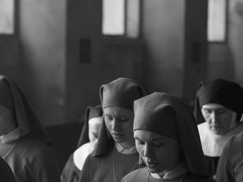 Movie still from “Ida” (2013), directed by Pawel Pawlikowski – A black and white photo of a group of nuns; Medium shot, High angle