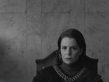 Movie still from “Ida” (2013), directed by Pawel Pawlikowski – A black and white photo of a woman sitting in a chair; Close Up shot, Over the shoulder angle