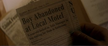 Movie still from “Identity” (2003), directed by James Mangold – An old newspaper article; Extreme Close Up shot, High angle
