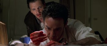 Movie still from “Identity” (2003), directed by James Mangold – A man with blood all over his face and hands; Close Up shot, Low angle
