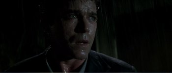 Movie still from “Identity” (2003), directed by James Mangold – A man's face in the rain; Close Up shot, Low angle